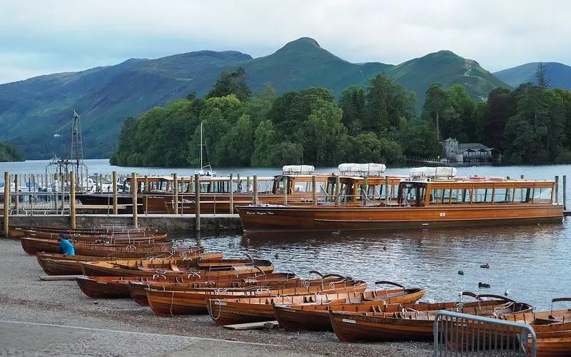 Scenic view of Keswick nestled by Derwentwater, with surrounding fells and nearby hotels offering perfect accommodation for Lake District visitors.